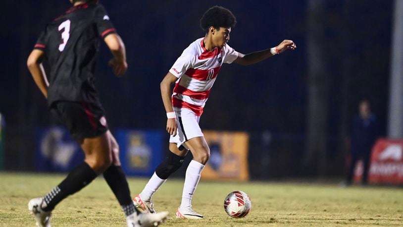 Dayton's Kenji Mboma Dem (right) was selected by FC Cincinnati on Tuesday in the MLS SuperDraft. UD Athletics photo