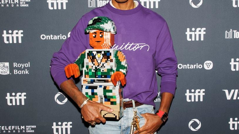 Pharrell Williams arrives on the red carpet for the premiere of 'Piece by Piece' at the Princess of Wales Theatre during the Toronto International Film Festival in Toronto, Tuesday, Sept. 10, 2024. (Cole Burston/The Canadian Press via AP)