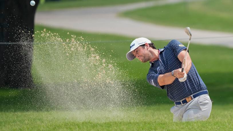 Davis Riley hits out of a trap on the second hole during the second round of the Charles Schwab Challenge golf tournament at Colonial Country Club, Friday, May 24, 2024, in Fort Worth, Texas. (AP Photo/LM Otero)