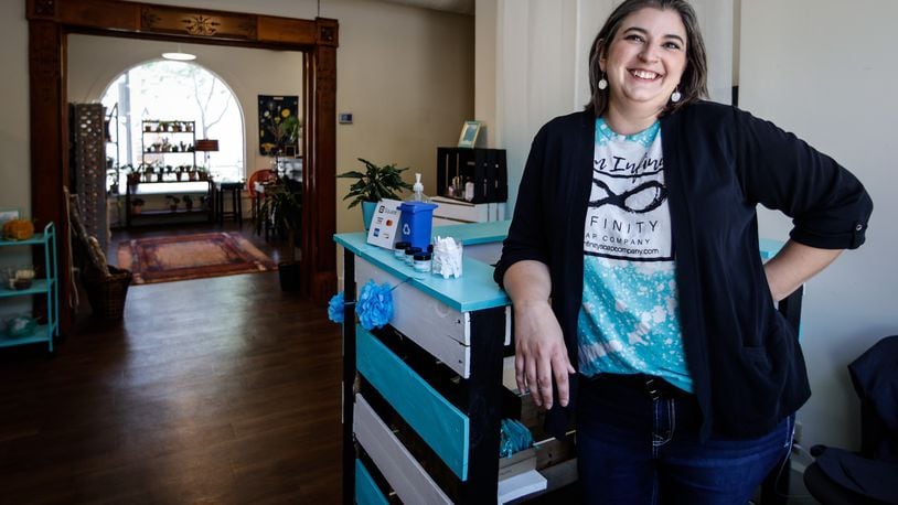 Bonnie Skinner founder of Infinity Soap Company specializes in handcrafted bath and body products at 4 North Main St. in Miamisburg. JIM NOELKER/STAFF