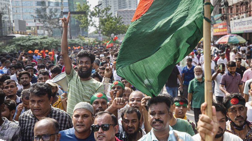 Supporters of the Bangladesh Nationalist Party (BNP) shout slogans during a rally demanding a democratic transition through an election in Dhaka, Bangladesh, Tuesday, Sept.17, 2024. (AP Photo/Rajib Dhar)