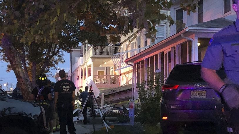 First responders work the scene of a building structure damage in Wildwood, N.J., on Saturday, Sept. 14, 2019. Officials say several people were injured when decks collapsed on one another at the three-story residence on the Jersey Shore.