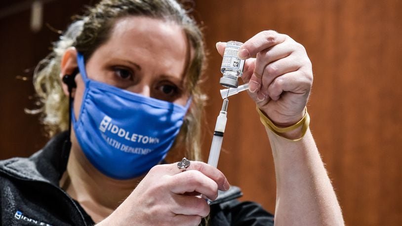 Local public health officials are pushing for more teens to get vaccinated as a surge of COVID cases and hospitalizations continues locally at the same time schools reopen everywhere. NICK GRAHAM / STAFF