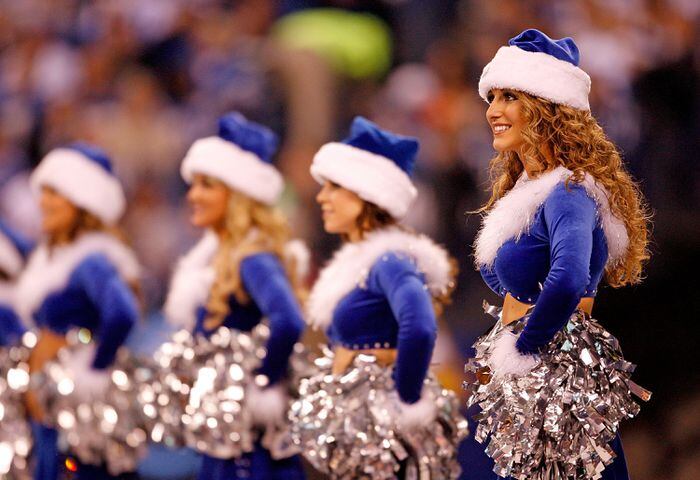 Dallas Cowboys cheerleader performs at halftime in her Santa Claus