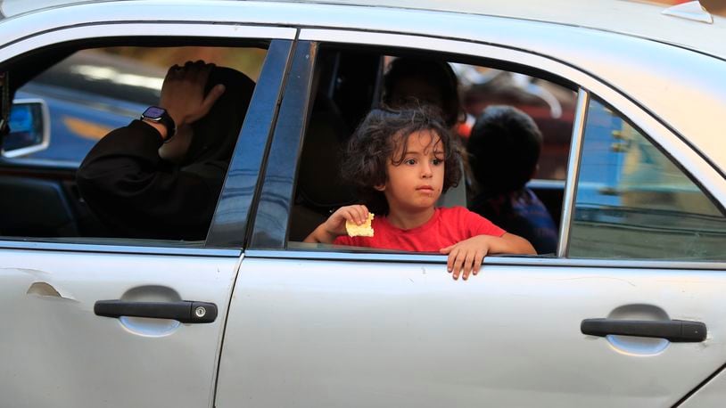 Cars sit in traffic as people flee the southern villages amid ongoing Israeli airstrikes, in Sidon, Lebanon, Monday, Sept. 23, 2024. (AP Photo/Mohammed Zaatari)