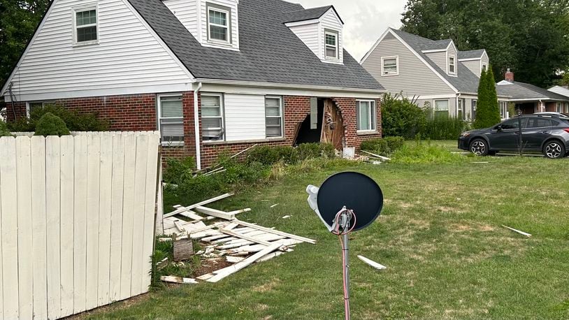 A car crashed into a house on Kenosha Road in Kettering on Monday, July 15, 2024. Police said no one was seriously injured. JEREMY P. KELLEY / STAFF