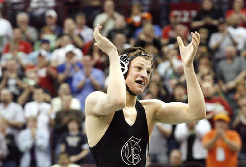 David Taylor of Graham claps as he receives a standing ovation from the crowd after defeating Manuel Cintron of Alliance at 135 lbs. to become a four-time Ohio state wrestling champion Saturday, March 7, 2009, at the Schottenstein Center in Columbus.