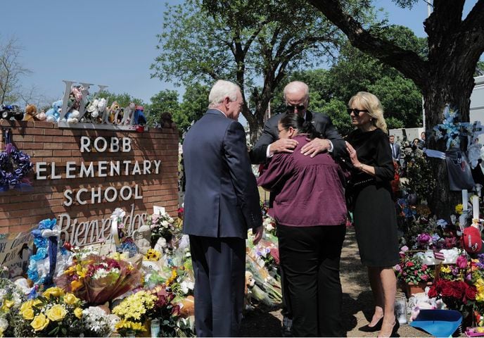 President Joe Biden and first lady Jill Biden visit a memorial for those killed in TuesdayÕs mass shooting at Robb Elementary School, outside the school in Uvalde, Texas, May 29, 2022. (Cheriss May/The New York Times)