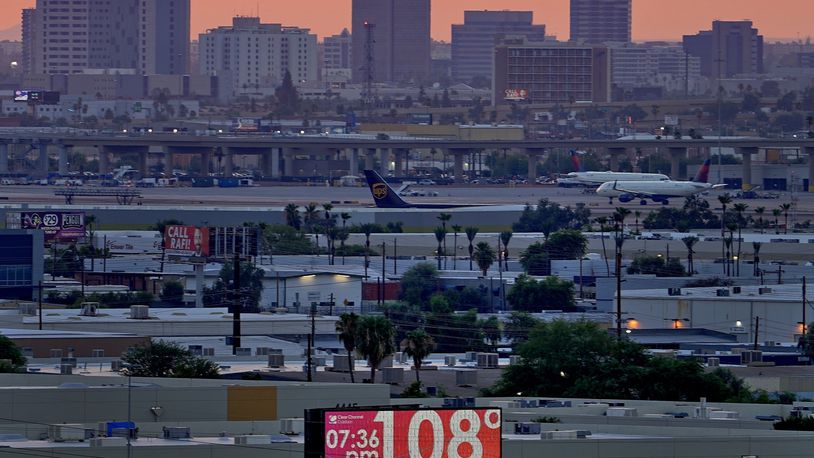 FILE - The unofficial temperature hits 108 degrees at dusk at Sky Harbor International Airport in Phoenix, on July 12, 2023. The U.S. last year saw the most heat waves since 1936, according to an Associated Press analysis of Centers for Disease Control and Prevention data. (AP Photo/Matt York, File)