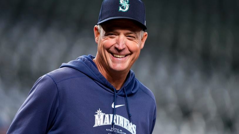 Seattle Mariners manager Dan Wilson smiles during batting practice before a baseball game against the San Francisco Giants, Friday, Aug. 23, 2024, in Seattle. (AP Photo/Lindsey Wasson)