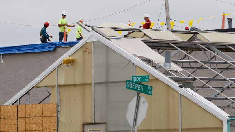 Contractors are working to repair all the damage done to Oberer’s Flowers on Troy Street in Old North Dayton. Greenhouses and warehouses of both Oberer’s and Furst Florist were hit hard by the Memorial Day tornado. TY GREENLEES / STAFF