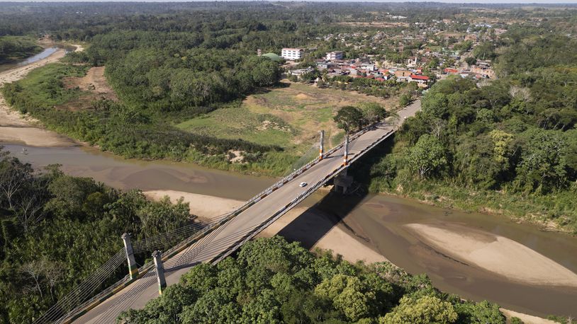 FILE - The Integration border bridge connects Assis, Brazil, left, and Iñapari, Peru, June 20, 2024. (AP Photo/Martin Mejia, File)