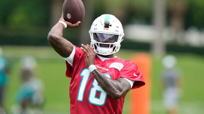 Miami Dolphins quarterback Tyler Huntley (18) throws a pass during practice at the NFL football team's training facility, Wednesday, Sept. 18, 2024, in Miami Gardens, Fla. (AP Photo/Lynne Sladky)