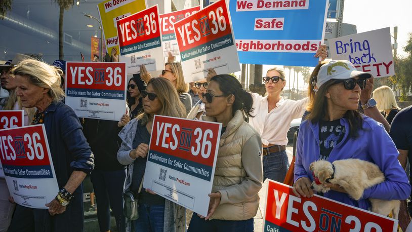 Neighbors and business owners join to support California's Proposition 36 on the November ballot at a news conference in the Venice neighborhood of Los Angeles on Monday, Sept. 30, 2024. (AP Photo/Damian Dovarganes)