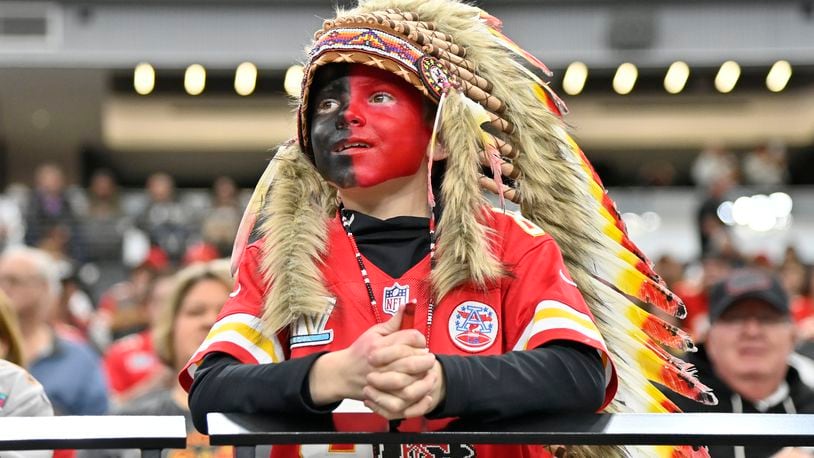 FILE - A young Kansas City Chiefs fan, dressed with a headdress and face paint, looks on during an NFL football game against the Las Vegas Raiders, Sunday, Nov. 26, 2023, in Las Vegas. (AP Photo/David Becker, File)