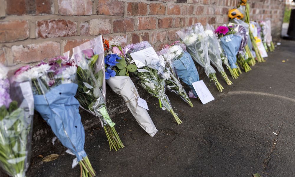 Floral tributes near the scene in Hart Street, Southport, Britain, Tuesday July 30, 2024, where two children died and nine were injured in a 