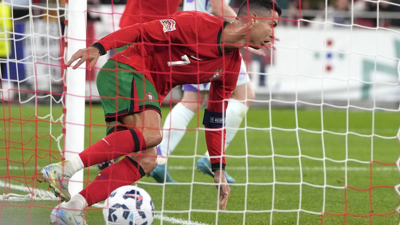 Portugal's Cristiano Ronaldo celebrates after scoring his side's second goal during the UEFA Nations League soccer match between Portugal and Scotland at the Luz stadium in Lisbon, Portugal, Sunday, Sept. 8, 2024. (AP Photo/Armando Franca)