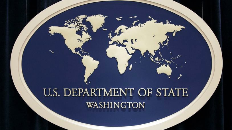 FILE - U.S. Department of State sign is seen at the State Department in Washington, Aug. 10, 2006. The State Department’s internal watchdog says that officials did not follow proper protocol when handling the security clearance suspension of the U.S. special envoy for Iran following allegations last year that he may have mishandled classified information. (AP Photo/Charles Dharapak, File)