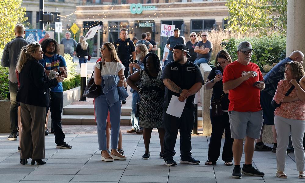 A crowd of people wait outside the Springfield City Commission Meeting, unable to get inside because capacity had been reached in the City Hall Forum Tuesday, Sept. 10, 2024. BILL LACKEY/STAFF