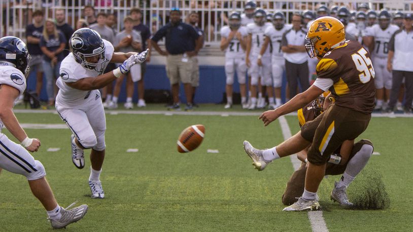 Fairmont's Kamron Payne blocks a field goal that led to a touchdown during Fairmont's 31-7 victory over Alter last year at Roush Stadium.