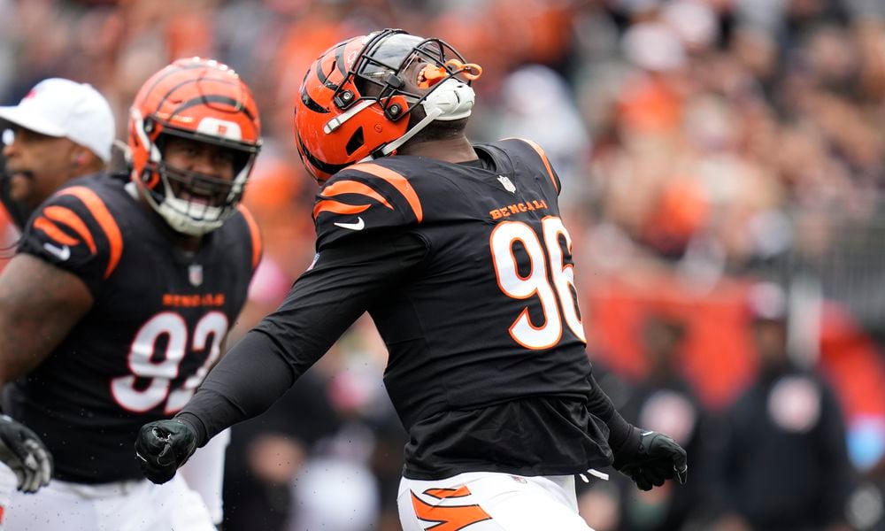 Cincinnati Bengals' Cam Sample (96) celebrates a sack of Seattle Seahawks quarterback Geno Smith during the first half of an NFL football game, Sunday, Oct. 15, 2023, in Cincinnati. (AP Photo/Michael Conroy)