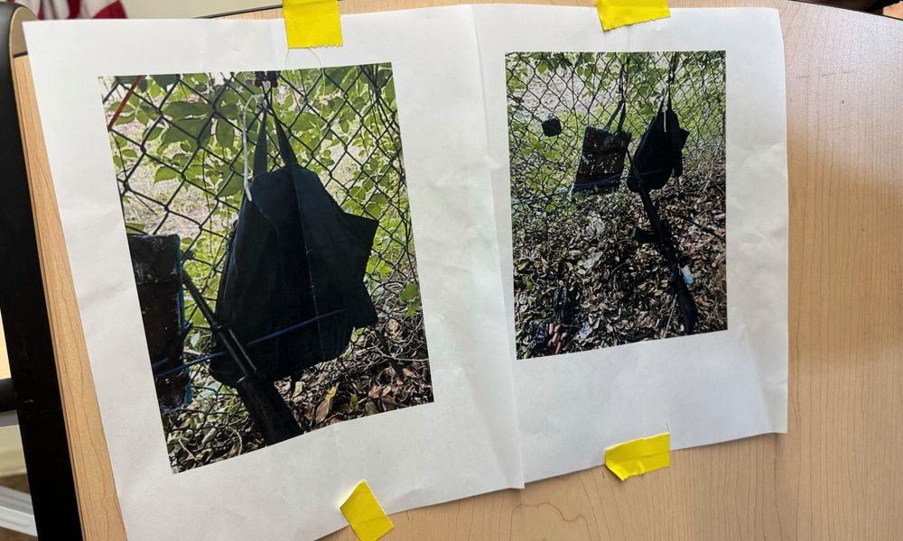 Photos that show an AK-47 rifle, a backpack and a Go-Pro camera on a fence outside Trump International Golf Club taken after an apparent assassination attempt of Republican presidential candidate former President Donald Trump, are displayed during a news conference at the Palm Beach County Main Library, Sunday. Sept. 15, 2024, in West Palm Beach, Fla. (AP Photo/Stephany Matat)