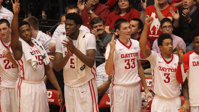 Dayton players cheer after a 3-pointer against Alabama on Tuesday, Nov. 17, 2015, at UD Arena in Dayton. David Jablonski/Staff