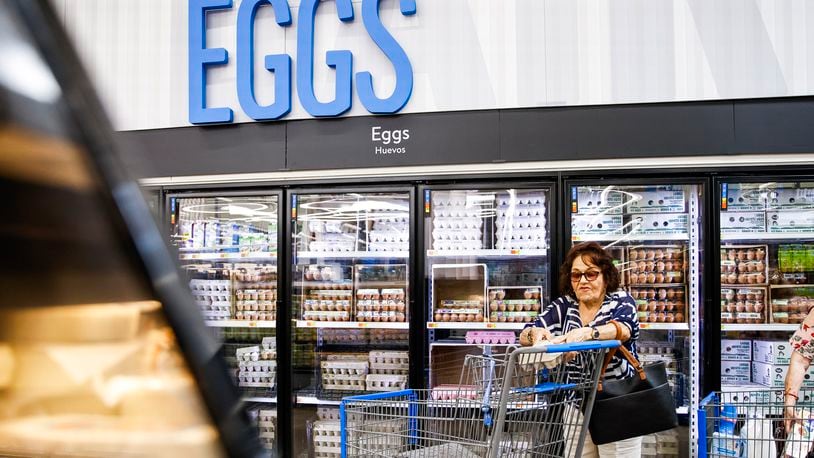 FILE - A woman buys eggs at a Walmart Superstore in Secaucus, New Jersey, July 11, 2024. (AP Photo/Eduardo Munoz Alvarez, File)