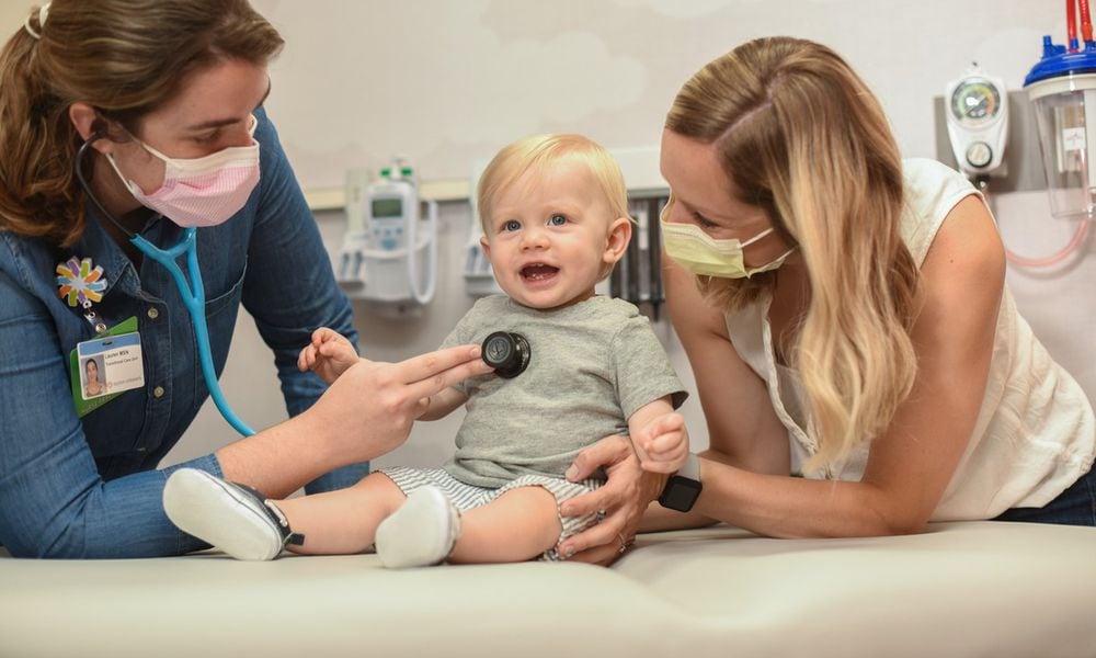 FILE - A doctor exams a patient at Dayton Children's Hospital. Dayton Children's has been seeing a gradual increase in COVID cases, but is expecting a winter wave of respiratory illnesses. Dayton Children's recommends infants get vaccinated against RSV this fall in order to prevent serious illness from RSV. COURTESY OF DAYTON CHILDREN'S HOSPITAL