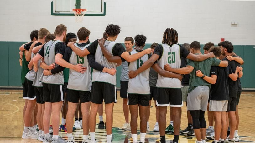 Wright State coach Clint Sargent (center) talks to his players during a workout this summer. Wright State Athletics photo