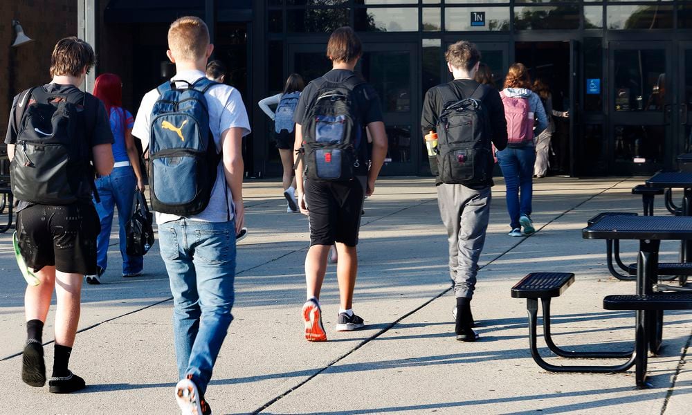 Students arrive Wednesday, Aug. 14, 2024 for the first day of school at Beavercreek High School. MARSHALL GORBY\STAFF