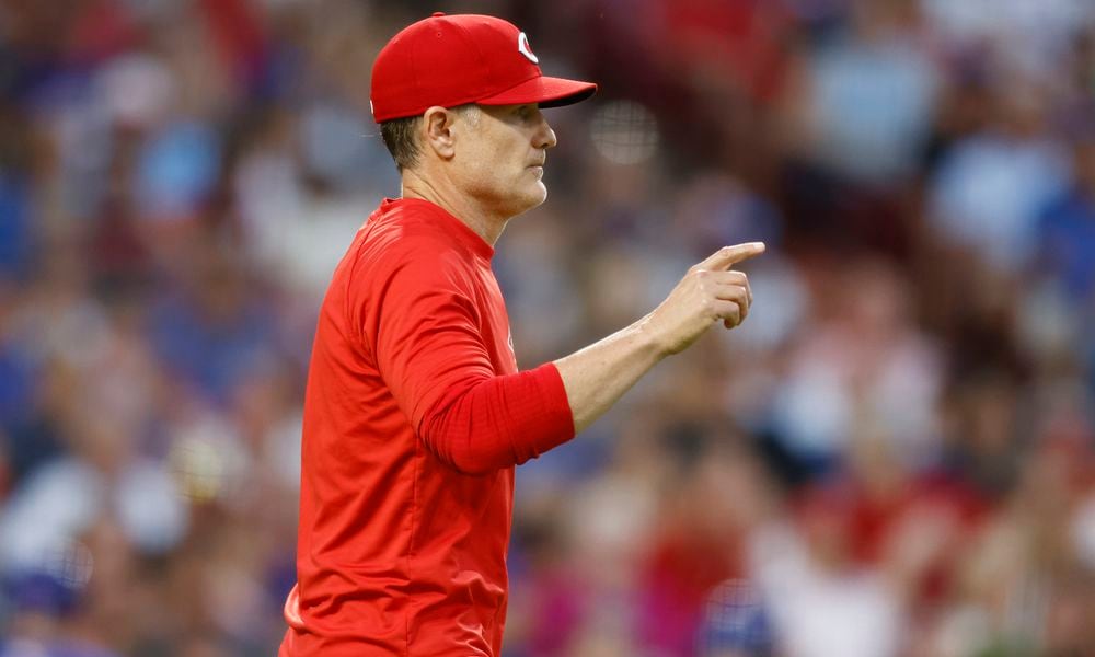 Cincinnati Reds manager David Bell walks to the mound during the seventh inning of the team's baseball game against the Chicago Cubs in Cincinnati, Thursday, June 6, 2024.. (AP Photo/Paul Vernon)