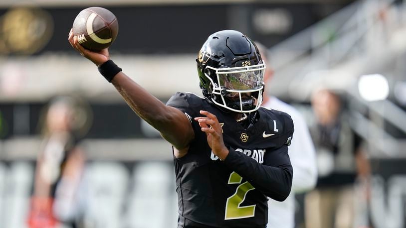 Colorado quarterback Shedeur Sanders warms up before an NCAA college football game against North Dakota State, Thursday, Aug. 29, 2024, in Boulder, Colo. (AP Photo/Jack Dempsey)