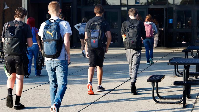 Students arrive Wednesday, Aug. 14, 2024 for the first day of school at Beavercreek High School. MARSHALL GORBY\STAFF