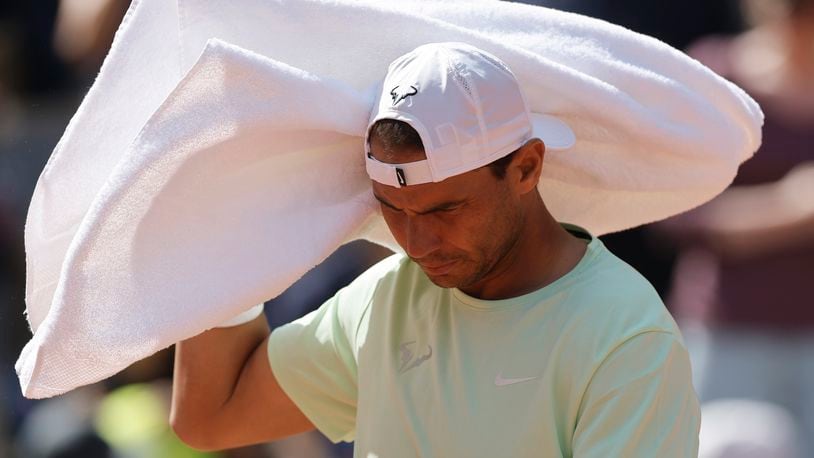 Spain's Rafael Nadal uses his towel as he trains at the Roland Garros stadium, Saturday, May 25, 2024 in Paris. The French Open tennis tournament starts Sunday May 26, 2024. (AP Photo/Jean-Francois Badias)