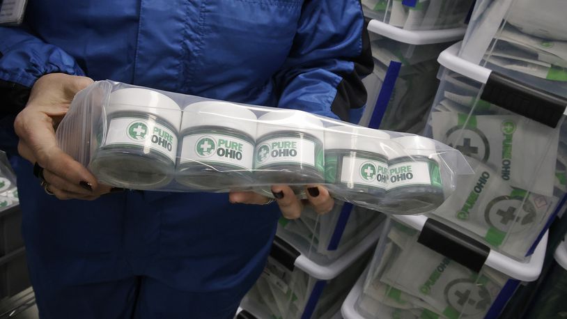 Some of the packaged cannibus ready for the dispensary Monday, Dec. 4, 2023 at the Pure Ohio Wellness production facility in Clark County. BILL LACKEY/STAFF