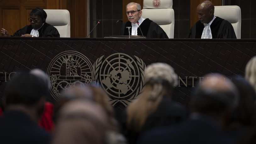 Presiding Judge Nawaf Salam reads the ruling of the International Court of Justice, or World Court, in The Hague, Netherlands, Friday, May 24, 2024, where the top United Nations court ruled on an urgent plea by South Africa for judges to order Israel to halt its military operations in Gaza and withdraw from the enclave. (AP Photo/Peter Dejong)