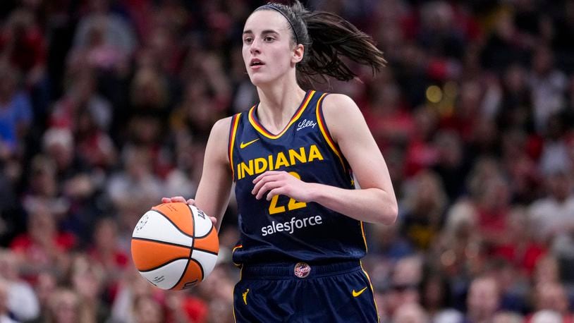 Indiana Fever guard Caitlin Clark (22) plays against the Los Angeles Sparks in the second half of a WNBA basketball game in Indianapolis, Wednesday, Sept. 4, 2024. (AP Photo/Michael Conroy)