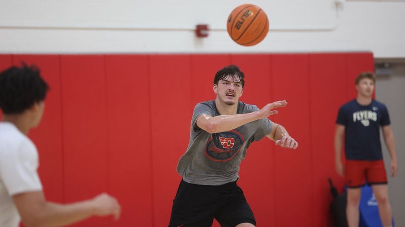 Dayton's isaac Jack makes a pass during a summer practice on Monday, July 22, 2024, at the Cronin Center. David Jablonski/Staff