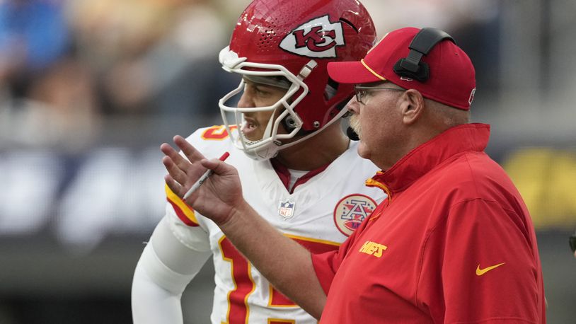 Kansas City Chiefs quarterback Patrick Mahomes, left, talks with head coach Andy Reid during the second half of an NFL football game against the Los Angeles Chargers Sunday, Sept. 29, 2024, in Inglewood, Calif. (AP Photo/Ashley Landis)