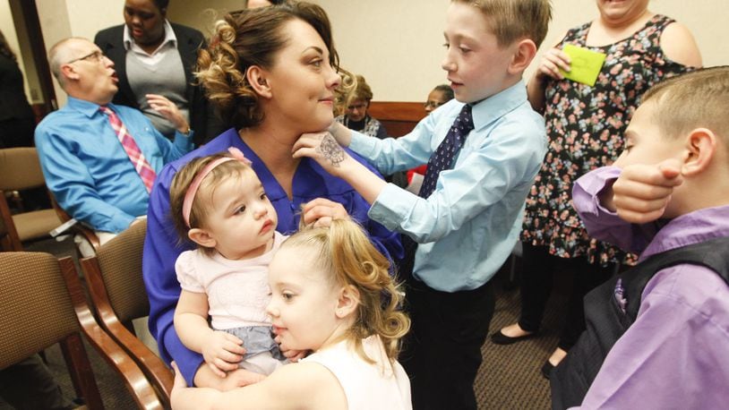 Bethany Hampton graduated from Family Treatment Court on Wednesday at Montgomery County Juvenile Court. To help celebrate were her sons Avory, 9, and Addison, 7, and daughters Alayna, 4, and Arily, 1. CHRIS STEWART / STAFF