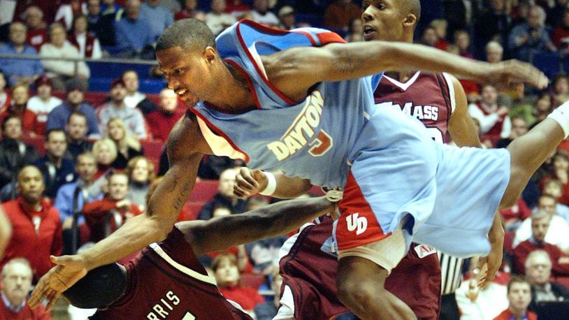 Dayton's Andres Sandoval (3) loses control of the ball on a move to the basket between UMass' Ricky Harris (5) and Dante Milligan during the first half of their Wednesday game on Jan. 17, 2008, at UD Arena. Staff photo by Chris Stewart