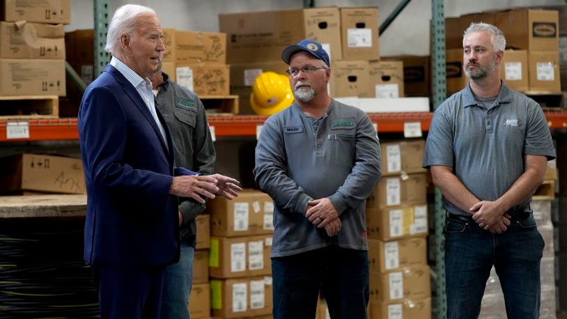 President Joe Biden, left, meets with workers from Dairyland Power Cooperative and Vernon Electric Cooperative during a visit to Vernon Electric in Westby, Wis., Thursday, Sept. 5, 2024. Biden is in Wisconsin to promote his Investing in America agenda. (AP Photo/Susan Walsh)