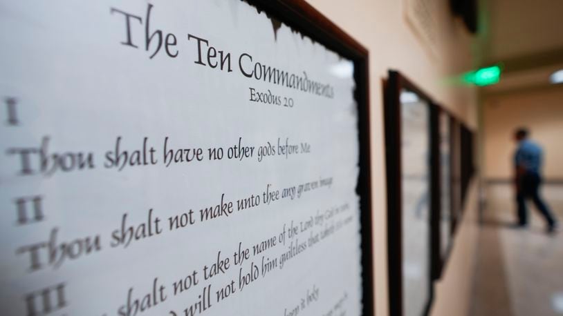FILE - A copy of the Ten Commandments is posted along with other historical documents in a hallway of the Georgia Capitol, Thursday, June 20, 2024, in Atlanta. Civil liberties groups filed a lawsuit Monday, June 24, challenging Louisiana’s new law that requires the Ten Commandments to be displayed in every public school classroom. (AP Photo/John Bazemore, File)