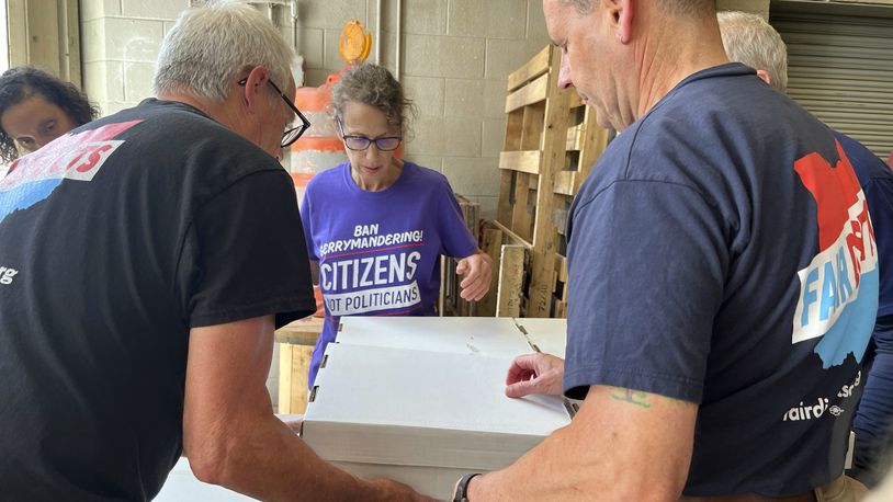 Volunteers with Citizens Not Politicians load boxes of signed petitions to Secretary of State Frank LaRose's office on Monday, July 1, 2024, in Columbus, Ohio. Backers of a proposal to change Ohio's troubled political mapmaking system delivered hundreds of thousands of signatures on Monday as they work to qualify for the statewide ballot this fall. (AP Photo/Patrick Orsagos)