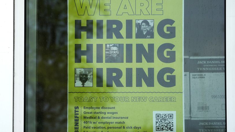 FILE - A hiring sign is displayed at a liquor store in Arlington Heights, Ill., May 21, 2024. (AP Photo/Nam Y. Huh, File)