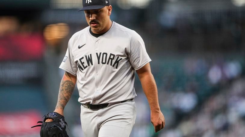 New York Yankees starting pitcher Nestor Cortes walks back to the dugout after retiring the side against the Seattle Mariners during the first inning of a baseball game Wednesday, Sept. 18, 2024, in Seattle. (AP Photo/Lindsey Wasson)