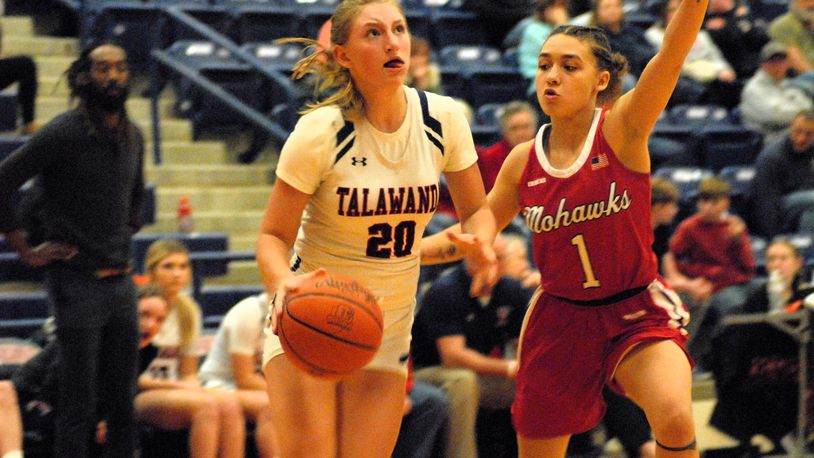 Talawanda's Sadie Van Gordon (20) drives past Madison's Malerie Bobbit (1) during a game last season. Chris Vogt/CONTRIBUTED