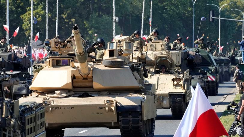 FILE - U.S.-made Abrams tanks purchased by Poland take part in a military parade in Warsaw, Poland, on Aug. 15, 2023. European Union countries are buying too much of their defense equipment abroad, almost two thirds of it in the United States, and failing to invest enough in joint military projects, a landmark report on EU competitiveness warned on Monday, Sept. 9, 2024, .(AP Photo/Czarek Sokolowski)