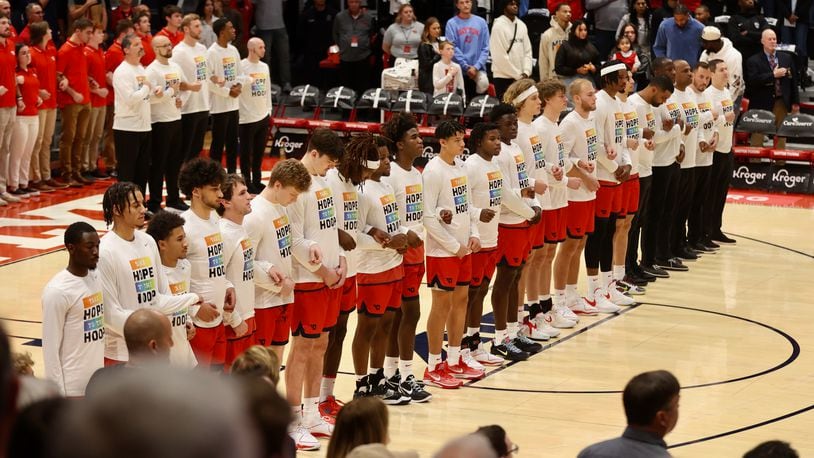 Dayton stands for the national anthem before an exhibition game against Ohio State on Sunday, Oct. 22, 2023, at UD Arena. David Jablonski/Staff